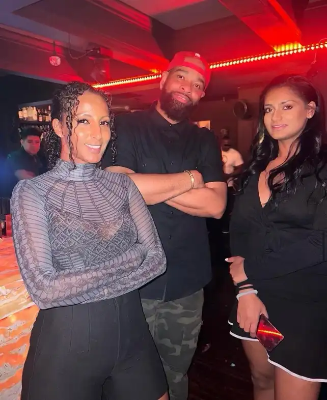 Black couple wearing ONE4THREE premium streetwear, photographed in Atlanta